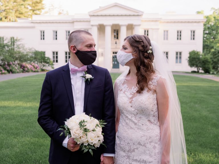 Bride and groom in face masks