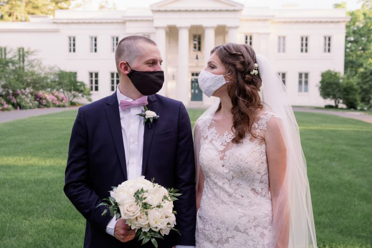 Bride and groom in face masks